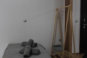 a bedroom with a bed with a mirror and a tripod at La Casa in Kozani +1 photo