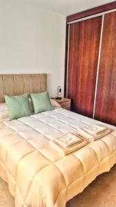 Postel nebo postele na pokoji v ubytování La Riviera CÁRCANO + 5 fotografií