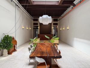 a conference room with a wooden table and chairs at Love Linn in George Town