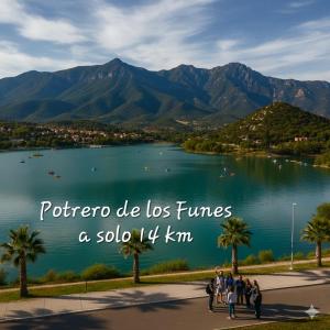 a group of people standing in front of a lake at Depto La Punta in La Punta +3 photos