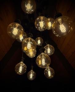 een stel glazen ballen hangend aan een plafond bij M Cabin A Frame Predeal 2 Ciubar in Predeal