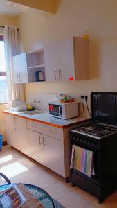 Nhà bếp/bếp nhỏ tại Maggie suites