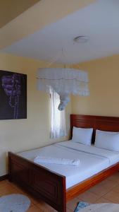 Giường trong phòng chung tại Maggie suites +19 ảnh