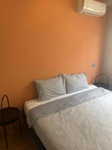 a bedroom with a bed with white sheets and pillows at Oliva 2 Bed Room in Casablanca