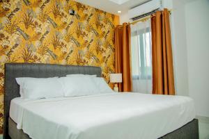 En eller flere senge i et værelse på Résidence Hôtel Missikewa Cocody-Angré