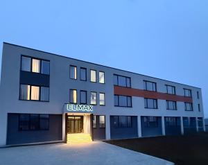 a building with the entrance to an office building at Elmax Aparthotel in Craiova