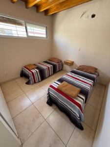 Ένα ή περισσότερα κρεβάτια σε δωμάτιο στο Refugio Malbec
