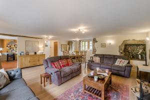 a living room with couches and a table at 4 Bed in Malham oc-c32684 in Airton