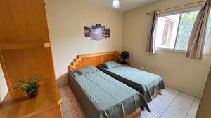 En eller flere senge i et værelse på Apartamentos Ecologic Park + 21 billeder