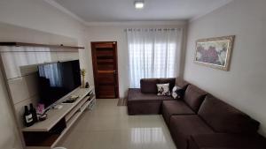 TV a/nebo společenská místnost v ubytování Casa Requinte