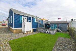 a blue house with a playground in a yard at Blue Chill in Hampton