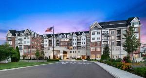 a rendering of the front of a hotel at Hotel Suites at Vanderbilt in Westbury