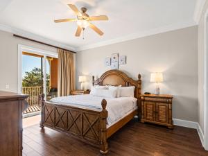a bedroom with a bed and a ceiling fan at Sanctuary at Redfish 3119 by Newman-Dailey in Santa Rosa Beach