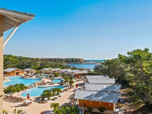an aerial view of the pool at the resort at Sanctuary at Redfish 3119 by Newman-Dailey in Santa Rosa Beach