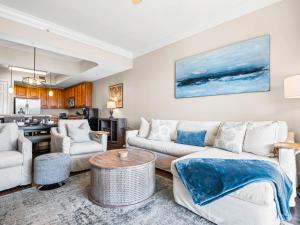 a living room with a couch and a table at Sanctuary at Redfish 3119 by Newman-Dailey in Santa Rosa Beach +104 photos