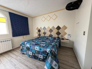 a bedroom with a bed in a room at Hotel-Motel Calens in Velasco +6 photos