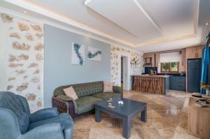 a living room with a couch and a table at Villa Safi in İslâmlar
