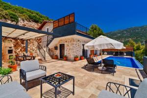 a villa with a swimming pool and a patio at Villa Safi in İslâmlar