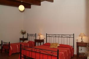 Postel nebo postele na pokoji v ubytování Agriturismo San Luigi