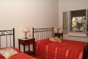 Postel nebo postele na pokoji v ubytování Agriturismo San Luigi