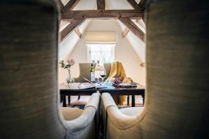 a view of a dining room with a table and chairs at The Herring's Residence - Stylish Private Cottage with Breakfast in Historic Center - Adults-Only in Bruges
