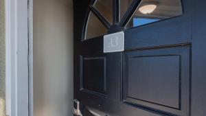 a black door with the number on it at Captains House A3 in Fernandina Beach