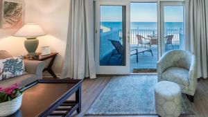 a living room with a view of the ocean at Captains House A3 in Fernandina Beach +26 photos