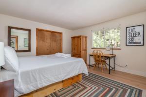 a bedroom with a bed and a desk and a chair at Sierra Sanctuary in Dorrington