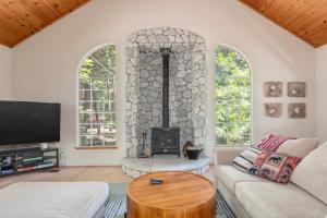 a living room with a couch and a fireplace at Sierra Sanctuary in Dorrington