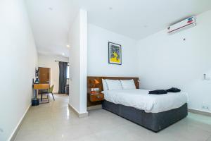 Giường trong phòng chung tại Arbor Boutique Hotel