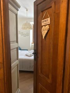 an open door to a bedroom with a bed at Colle House in Rivisondoli