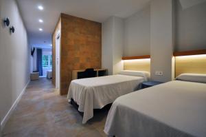 Postel nebo postele na pokoji v ubytování El Camí Hotel