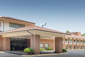 an image of the front of a school building at Days Inn by Wyndham Lexington in Lexington