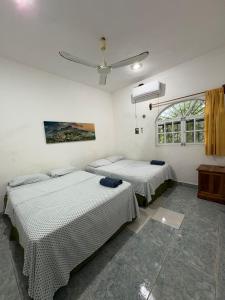 Ένα ή περισσότερα κρεβάτια σε δωμάτιο στο Casamaya Hostel & Diving