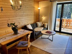 a living room with a couch and a table at Landhaus Barbara in Kitzbühel