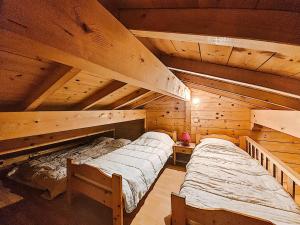 En eller flere senge i et værelse på Chalets à Morzine - Clévie MAE-1291