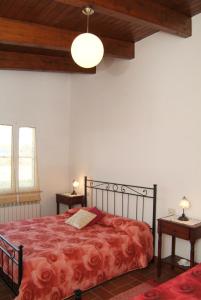 Postel nebo postele na pokoji v ubytování Agriturismo San Luigi