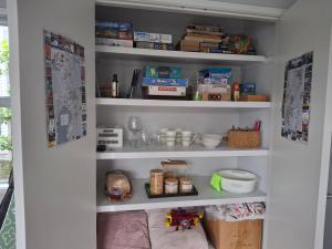 a pantry with shelves filled with food and other items at The Coop in Kinloch