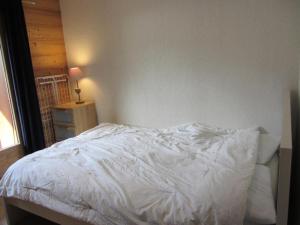 En eller flere senge i et værelse på Résidence Chamois - Chamois 22 MAE-5363