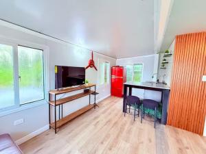 a kitchen with a desk and a table with two chairs at Casa Vagon Isla Bendita 2 in La Gonzalez