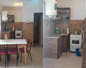 a kitchen with a table and some chairs and a stove at Bungalow El Pini in Chajarí