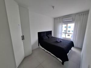 En eller flere senge i et værelse på Conforto e Mar em Navegantes SC