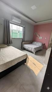 En eller flere senge i et værelse på Casa Paraíso do Sal