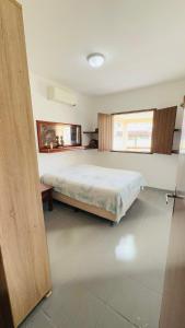 Giường trong phòng chung tại Casa Sol Tamandaré +6 ảnh