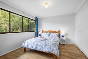 En eller flere senge i et værelse på Trial Bay Bush Haven