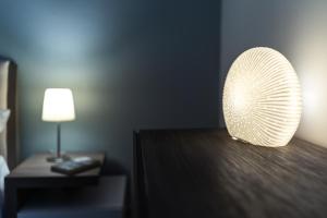 En eller flere senge i et værelse på Casa del Limone Lemonhousect