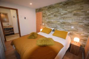 a bedroom with a large bed with grass on it at Résidence Alpine Loft - 5 Pièces 10 pers- HAUT DE GAMME - ALPINE LOFT - 10ALPI - PLAGNE CENTRE MAE-2634 in Aime-La Plagne
