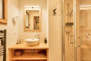 a bathroom with a sink and a shower at Résidence Alpine Loft - 5 Pièces 10 pers- HAUT DE GAMME - ALPINE LOFT - 10ALPI - PLAGNE CENTRE MAE-2634 in Aime-La Plagne