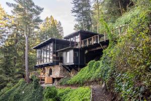 a house on the side of a hill at Two Creeks Treehouse in Mill Valley