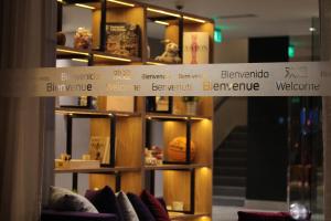 a sign that reads benjamin bennettwerkine is on a shelf at Campanile Shanghai Bund Hotel in Shanghai